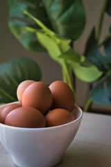 Fresh eggs on wooden table.