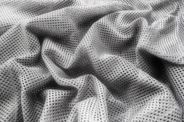 Synthetic fabric with holes laid in waves. Beautiful drape. Fabric for curtains, interior design,...