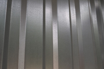 aluminum chrome metal profiled sheet with vertical stripes. metallic gray