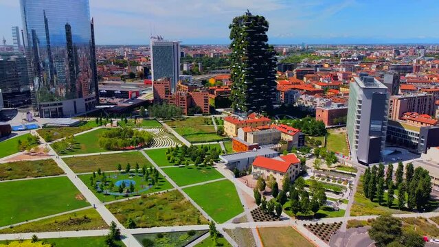Aerial view of ecological skyscrapers with many trees on each balcony. Bosco Verticale. Modern architecture, vertical gardens, terraces with plants. Ecology. Green Planet. Milan. Italy, 06.2022