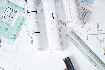 Working tools and drawings of the designer on a white background. Construction of houses, drawing, interior design.