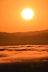 sunset over the clouds