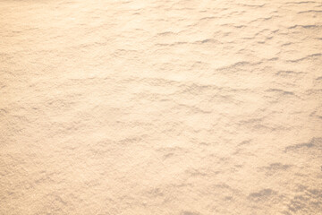 Fototapeta na wymiar Sand beige substrate. Delicate rough background.