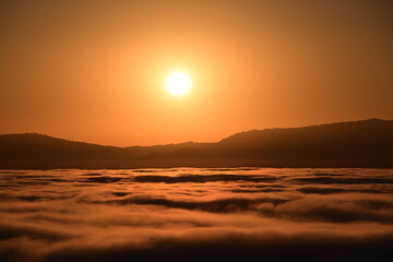 sunrise over the clouds