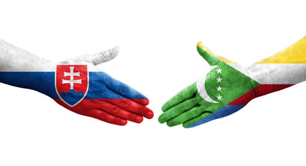 Handshake between Comoros and Slovakia flags painted on hands, isolated transparent image.