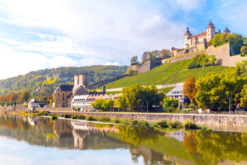 The hillside medieval Marienberg Fortress along the banks of the Main River in the historic...