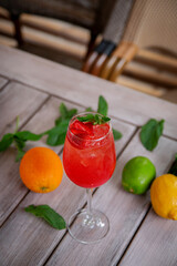 Prosecco with Rossini strawberry puree. Alcoholic italian cocktail with sparkling wine, fresh strawberry puree and ice in champagne glasses