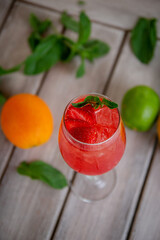 Prosecco with Rossini strawberry puree. Alcoholic italian cocktail with sparkling wine, fresh strawberry puree and ice in champagne glasses