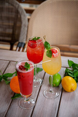Prosecco with Rossini strawberry puree. Alcoholic italian cocktail with sparkling wine, fresh strawberry puree and ice in champagne glasses