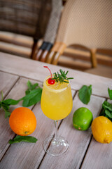 alcoholic cocktail winter aperol spritz with rosemary and cherry