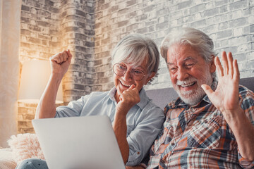 Portrait of mature people shocked for a result. Old couple reacting to an unexpected new on their...