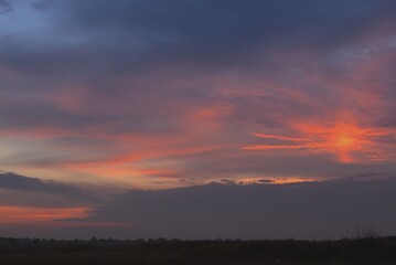 Autumn pink sunset, beautiful high sky, evening landscape of an endless field, Krasnodar region, Russia