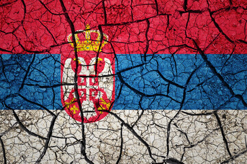 Dry soil pattern on the flag of Serbia. Country with drought concept. Water problem. Dry cracked earth country.	