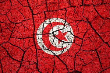 Dry soil pattern on the flag of Tunisia. Country with drought concept. Water problem. Dry cracked earth country.	