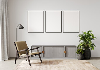 Blank three picture frames mock up in light room interior with armchair, 3d rendering