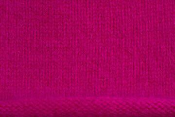 bright pink knitted fabric as a textured backdrop