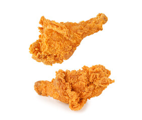Fried chicken legs falling in the air isolated on white background.