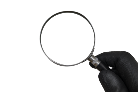 Detective with black glove is holding magnifying glass in hand.