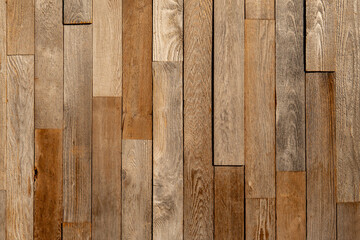 Texture of the pine boards lie vertically. Vertical wooden brown and grey bars background