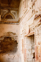 Ruins in rock of the structure of a church, with the detailed artistic engravings of the masonry and masonry in sight, in