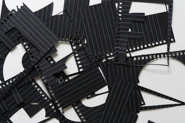 background with cut black note paper with lines