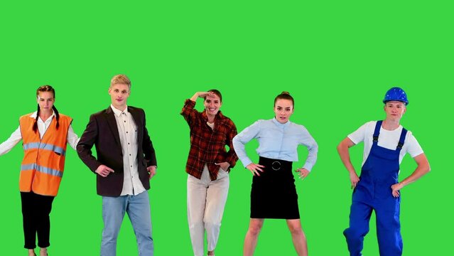 People of different professions and occupations walk in and dance on a Green Screen, Chroma Key.