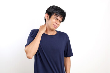 Young asian man suffering from neck and back pain. Isolated on white background with copyspace