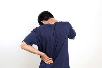 Back view of Young asian man suffering from neck and back pain. Isolated on white background with copyspace