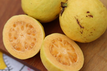 Naklejka na ściany i meble Yellow and juicy tropical fruit. Yellow and juicy guava.
