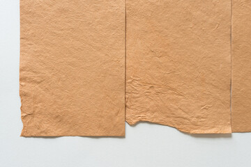 rough, textured sand brown paper background with curious edges