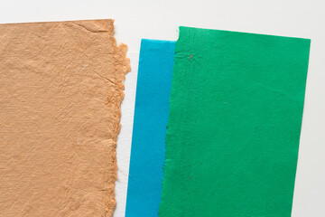 sand brown green and blue textured card stock on blank paper