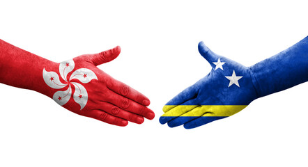 Handshake between Curacao and Hong Kong flags painted on hands, isolated transparent image.