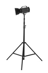 Studio flash light on tripod against white background. Professional photographer's equipment
