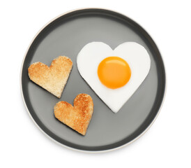 Plate with heart shaped fried egg and toasts isolated on white, top view