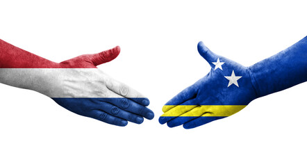 Handshake between Curacao and Netherlands flags painted on hands, isolated transparent image.