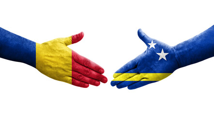 Handshake between Curacao and Romania flags painted on hands, isolated transparent image.