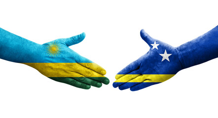 Handshake between Curacao and Rwanda flags painted on hands, isolated transparent image.
