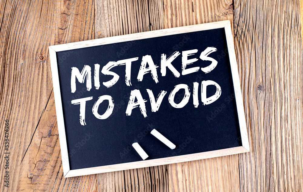 Poster mistakes to avoid text on a chalkboard on the wooden background
