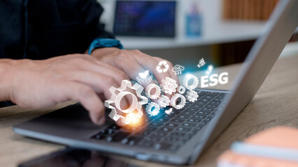 Business hand clicks ESG icon in the hand for environmental, social, and governance in sustainable concept