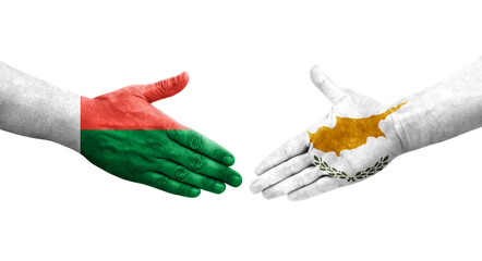 Handshake between Cyprus and Madagascar flags painted on hands, isolated transparent image.