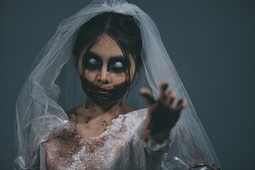 Portrait of asian woman make up ghost bride death and blood the horror is darkness scary horror...