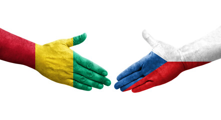 Handshake between Czechia and Guinea flags painted on hands, isolated transparent image.