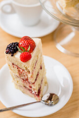 Slice of blackberry and strawberry pie on a plate. 