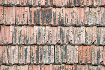 Closeup surface of old weathered ceramic tiles covering building roof