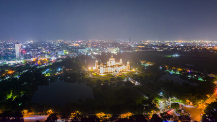 Aerial view of The Victoria Memorial during night, a large marble building in Central Kolkata, West...