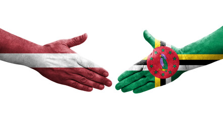 Handshake between Dominica and Latvia flags painted on hands, isolated transparent image.
