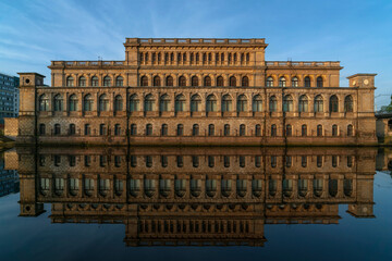 Fototapeta na wymiar View of the Regional Museum of Fine Arts in the former building of the Koningsberg Stock Exchange from Pregolya River with reflection in the water on a sunny summer day, Kaliningrad, Russia