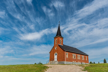 Blue sky and clouds over St. Johns Lutheran Church in Edenwold, near Regina, SK 