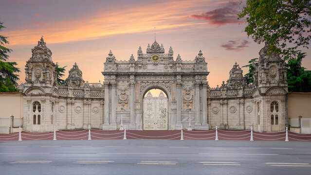 Sunset shot of closed gate leading to former Ottoman Dolmabahce Palace, or Dolmabahce Sarayi, suited in Ciragan Street, Besiktas district, Istanbul, Turkey