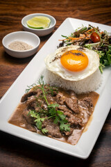 Traditional cambodian Lok Lak stir fried beef with rice meal